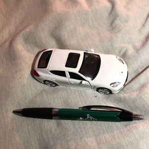 White Porsche Panamera S pull back action